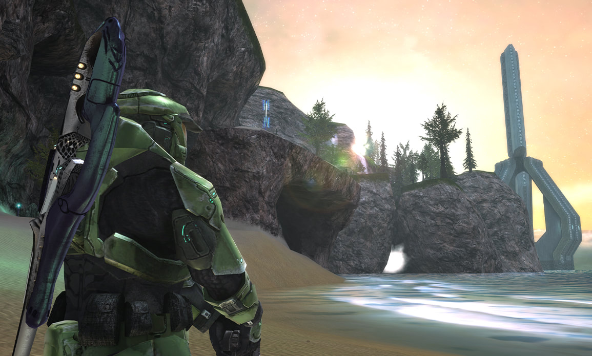 The Master Chief looks out over the ocean at the sun rising over looming cliffs, with a towering structure silhouetted behind them.